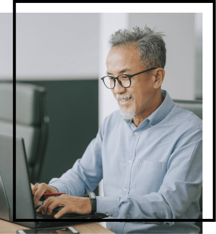 A man works on a laptop